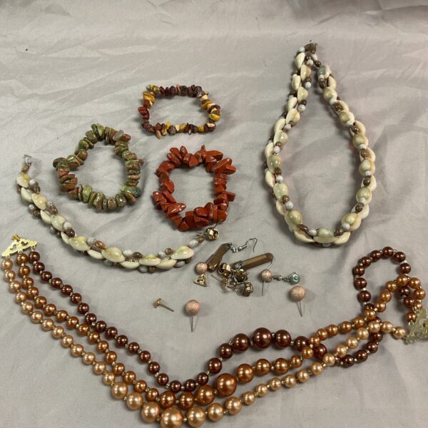 Colourful stone jewellery lot including necklaces, bracelets and earrings.