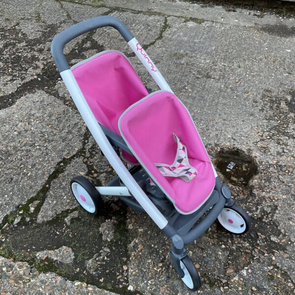 Pink Quinny doll pushchair, vintage toy for imaginative play.