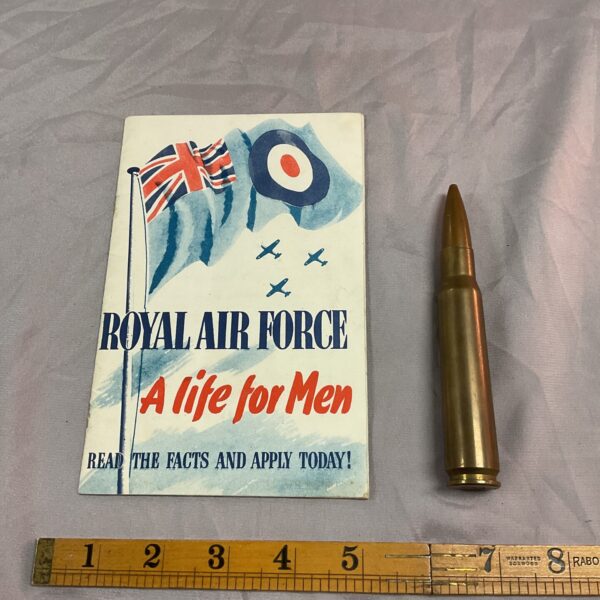 Vintage RAF application booklet and 50 caliber bullet, military collectible.