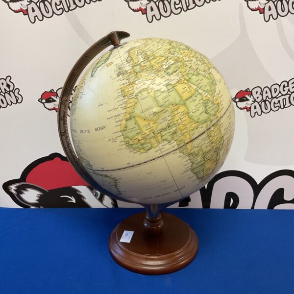 Vintage desktop globe with raised relief detailing.