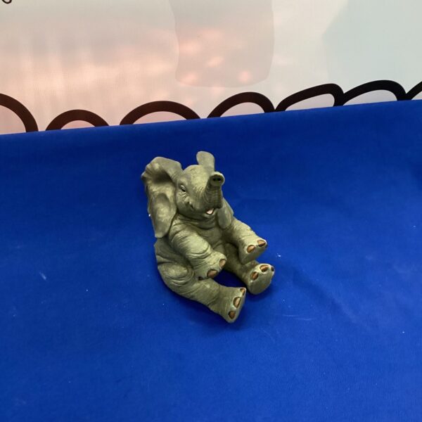 Detailed resin elephant figurine for home decor and collecting.
