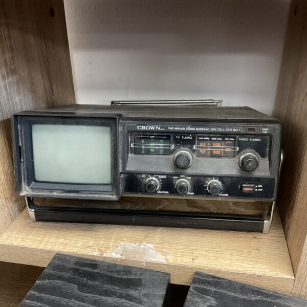 Vintage Crown portable television radio with tuning dial.