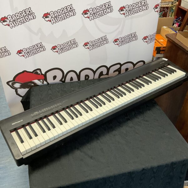 Black Roland FP-30 keyboard with all keys visible.