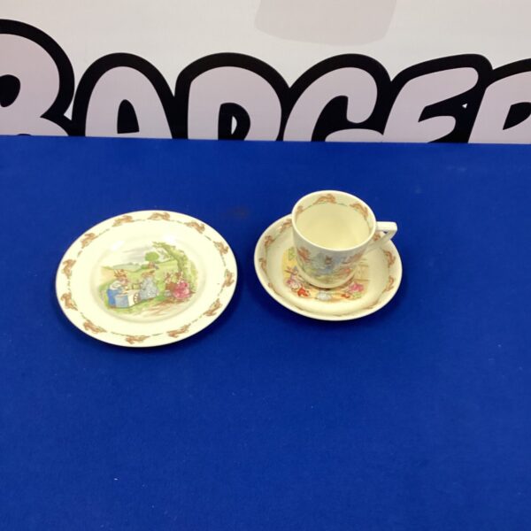 Vintage Royal Doulton Bunnykins cup and saucer with charming bunny design.