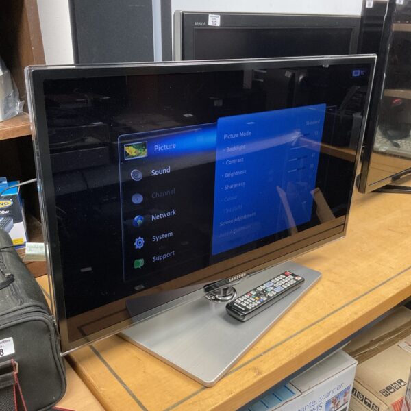 Samsung 32 inch HD smart TV with remote control.