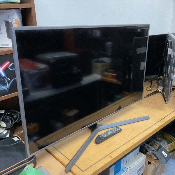 Samsung 50 inch HD TV with remote control for home entertainment.