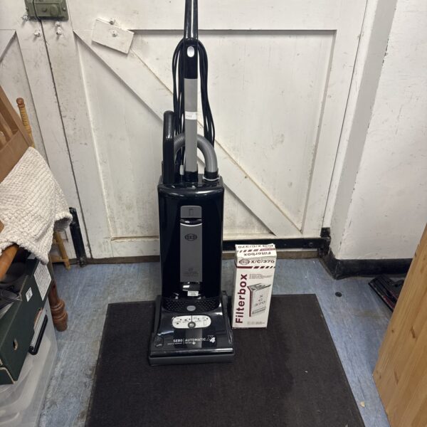 Used Sebo X4 cylinder vacuum cleaner with spare bags included.