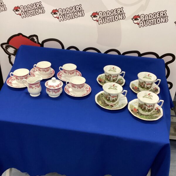 Vintage bone china tea cups and saucers with floral design.