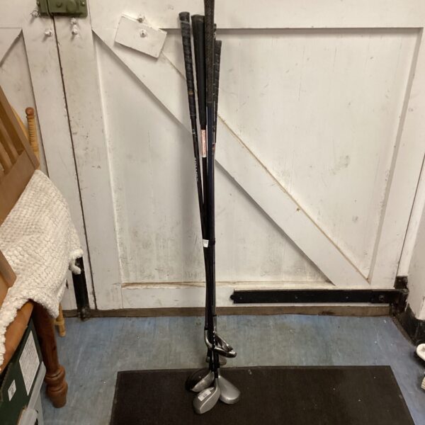 Selection of used golf clubs including Callaway and Adams irons.