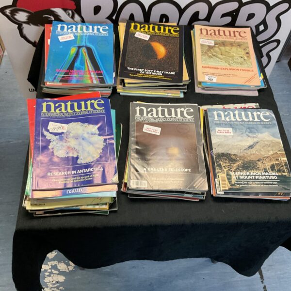 Stack of vintage *Nature* magazines, a collectible science publication.