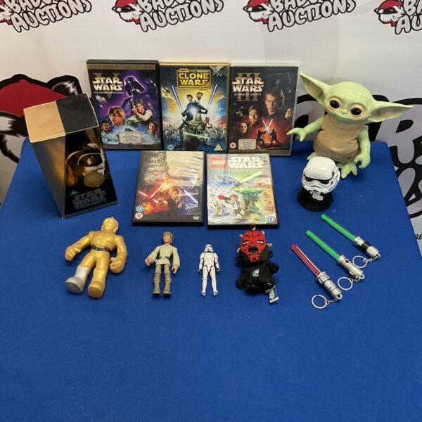 Overview of a Star Wars collectibles lot with DVDs and figures.