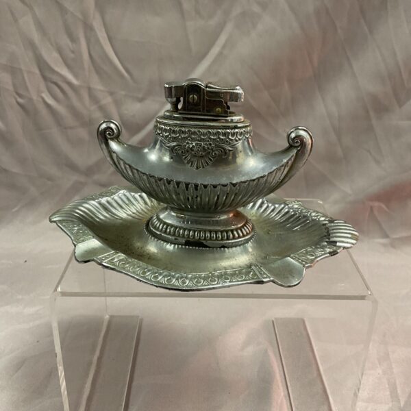 Vintage silver tone MTCTable lighter with integrated tray.