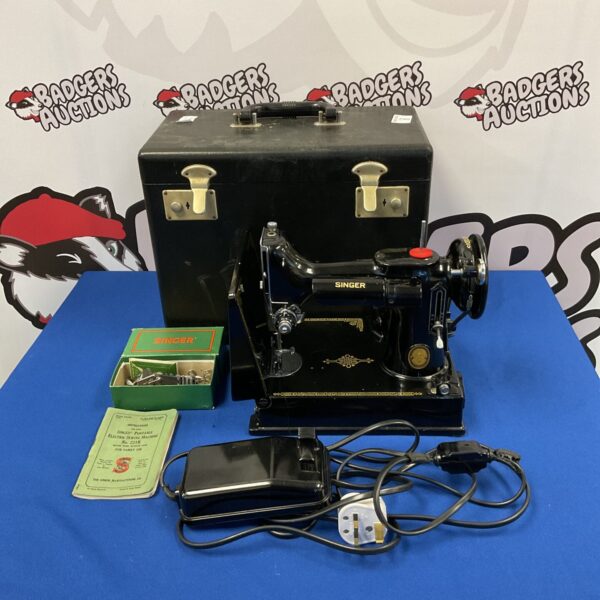 Vintage Singer Featherlite sewing machine in its original case.