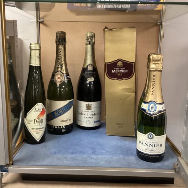 Assorted champagne bottles including Mercier, a collectible wine lot.