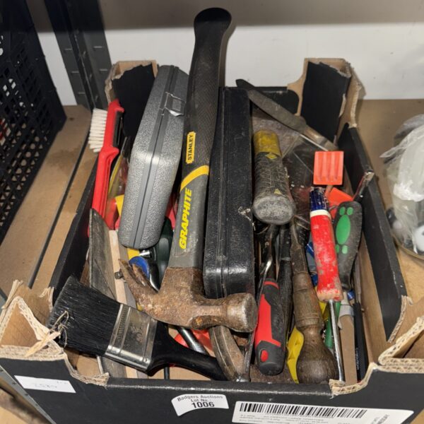 Tray of assorted hand tools including hammers and chisels.