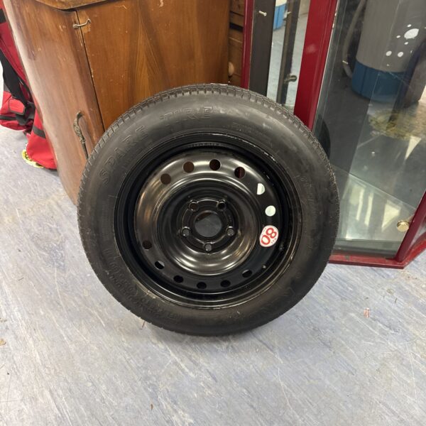 Used Honda CRV space saver wheel for temporary tire replacement.