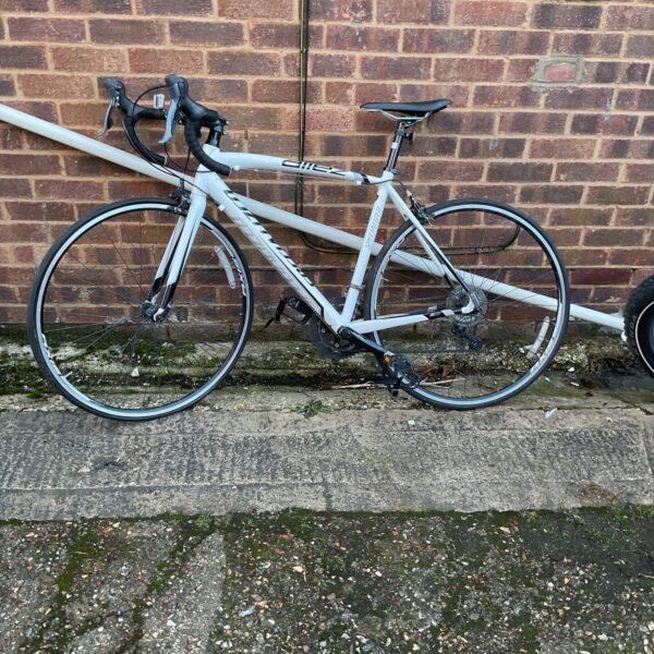 Side view of a Specialized Allez road bike in good condition.