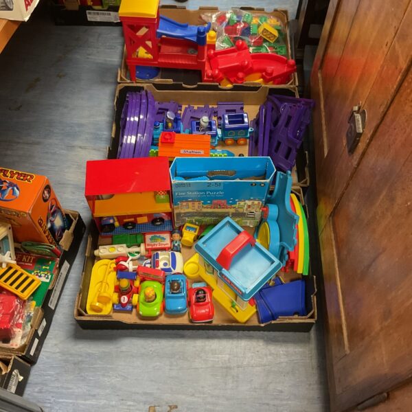 Mixed lot of childrens toys including a train and fire engine.