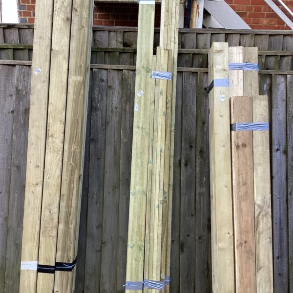 Mixed lengths of timber bundles stored outdoors, ready for DIY projects.