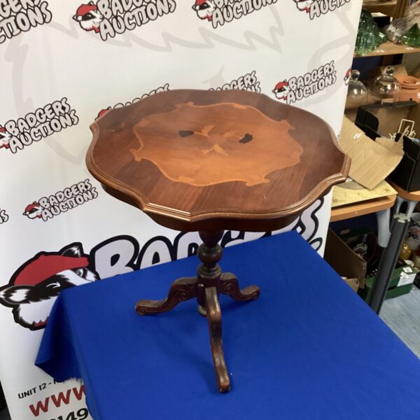 Vintage inlaid occasional table with three legs.
