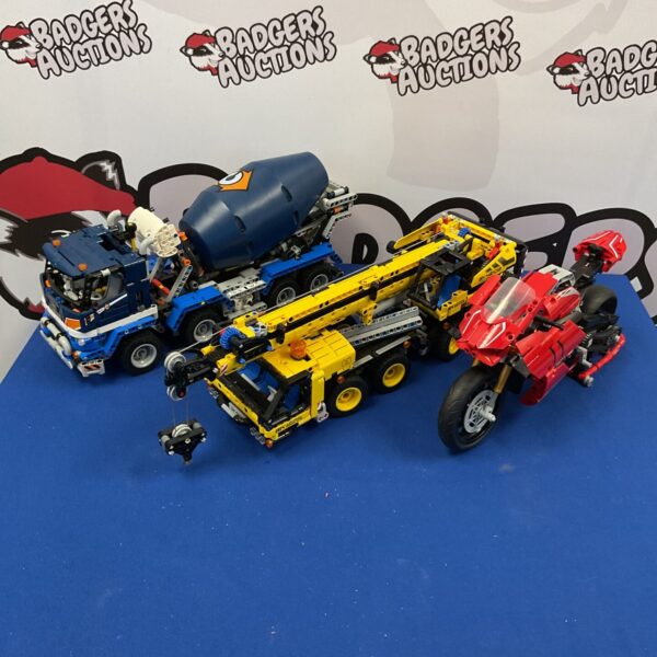 Lego Technic vehicles including a crane and motorcycle building set.