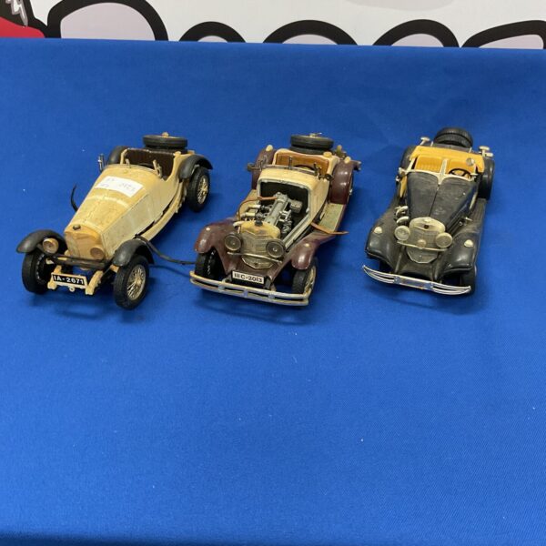 Lot of three vintage Burago diecast model cars.