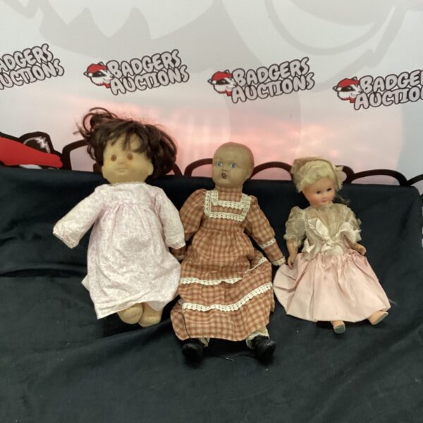 Group of three vintage composition dolls, collectible toys.