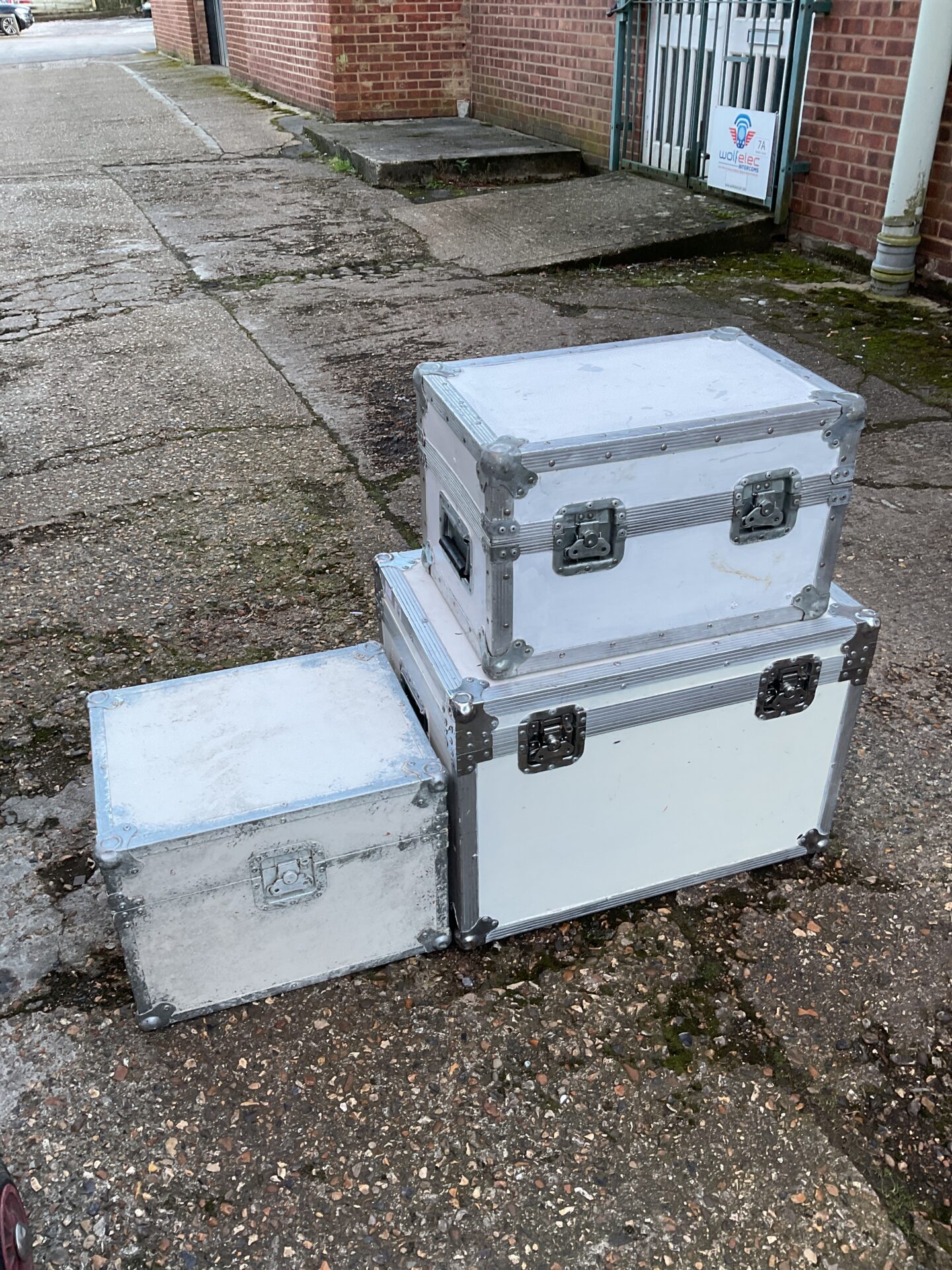 1148 Three white painted aluminium transit boxes