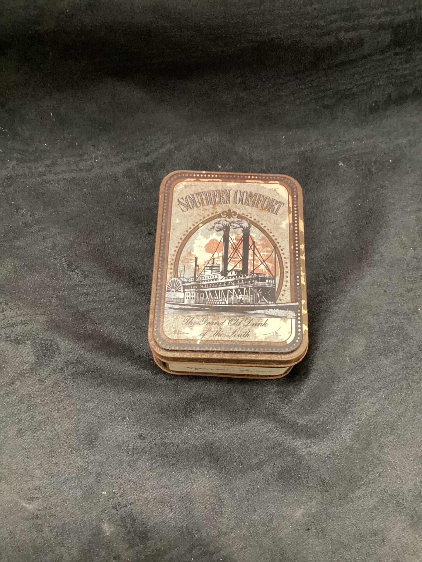 952 Tin containing Two small bottles of Southern Comfort