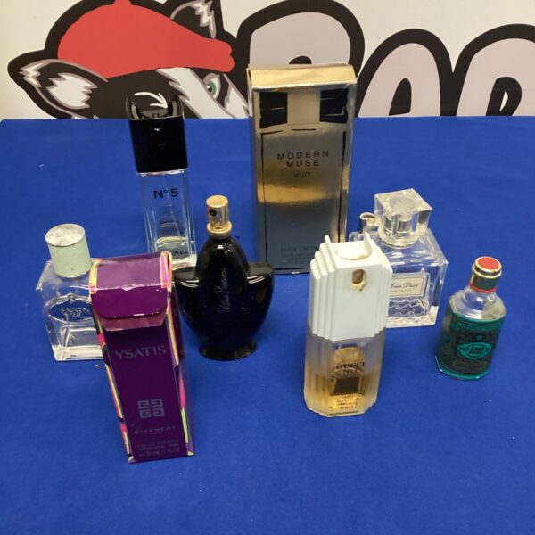 Vintage perfume lot featuring Dior and Gucci bottles.