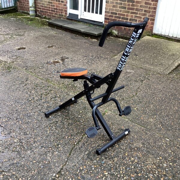 Vintage Total Crunch exercise machine for abdominal workouts.