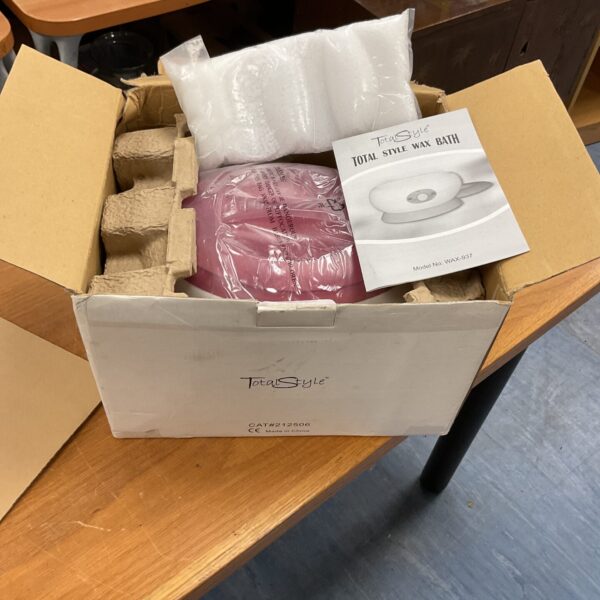 Total Style wax bath with new wax for home spa treatments.