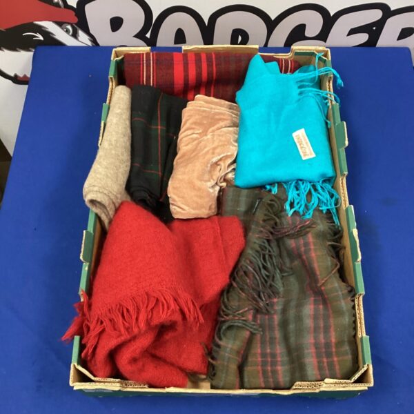 Tray of assorted cashmere scarves in various colours and patterns.