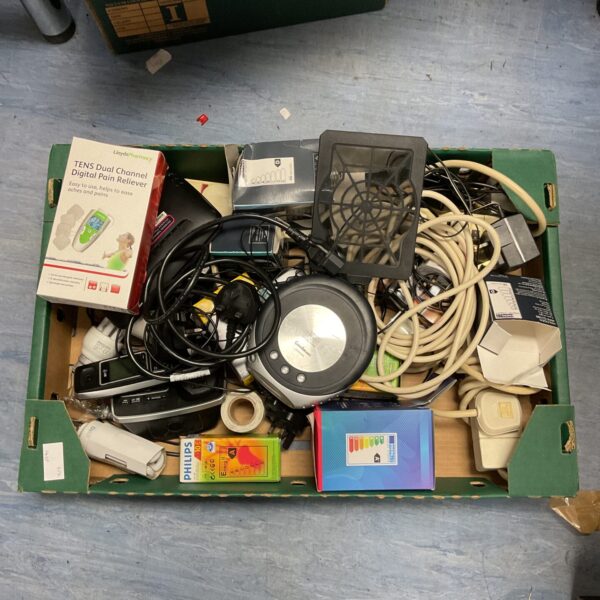 Tray of vintage electronics including a TENS machine and CD walkman.