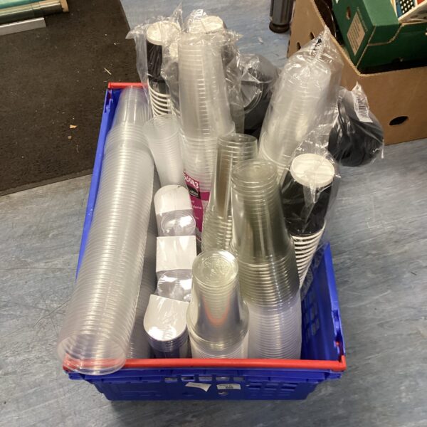 Mixed lot of disposable catering cups and glasses for events.