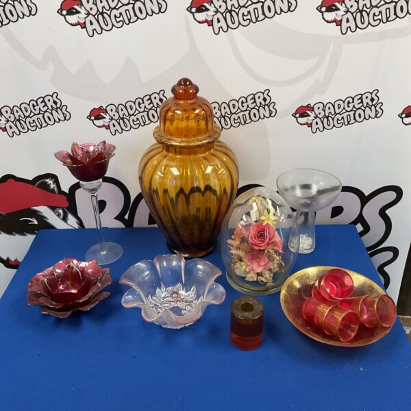Vintage amber glass urn on a tray of mixed glassware.