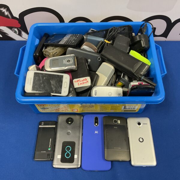 Tray of vintage mobile phones and chargers for collectors.