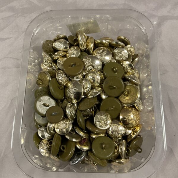 Lot of vintage British military buttons in a plastic tub.