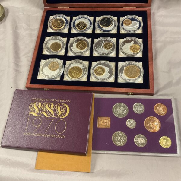 Presentation case containing 1970 British pre-decimalisation coin sets.