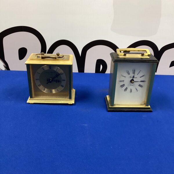 Antique brass carriage clocks including London Clock Company piece.