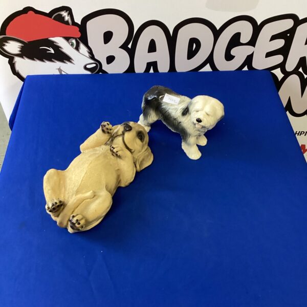 Vintage porcelain dog figurines, including an Old English Sheepdog.