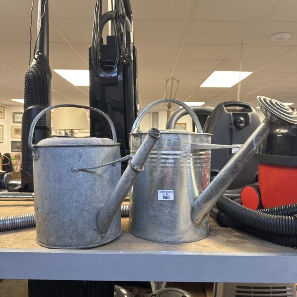 Vintage galvanised watering can for garden use.