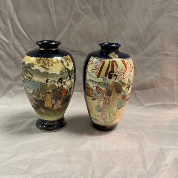 Antique Japanese Meiji vases with hand-painted scenes.