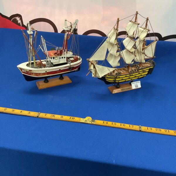 Pair of detailed model boats, including HMS Victory, for collectors.