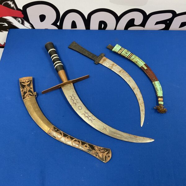 Antique pair of North African Nimcha swords with curved blades.