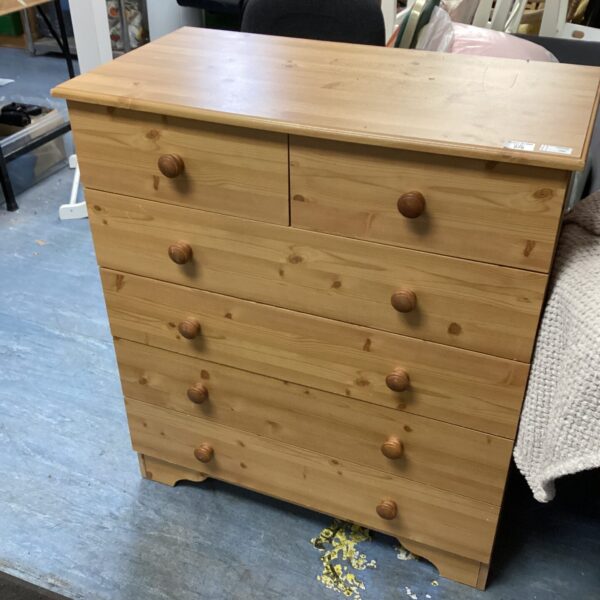 Pine chest of drawers with two over four drawer configuration.