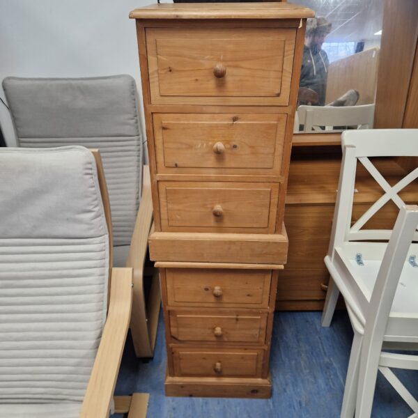 Pair of rustic pine bedside cabinets with three drawers.