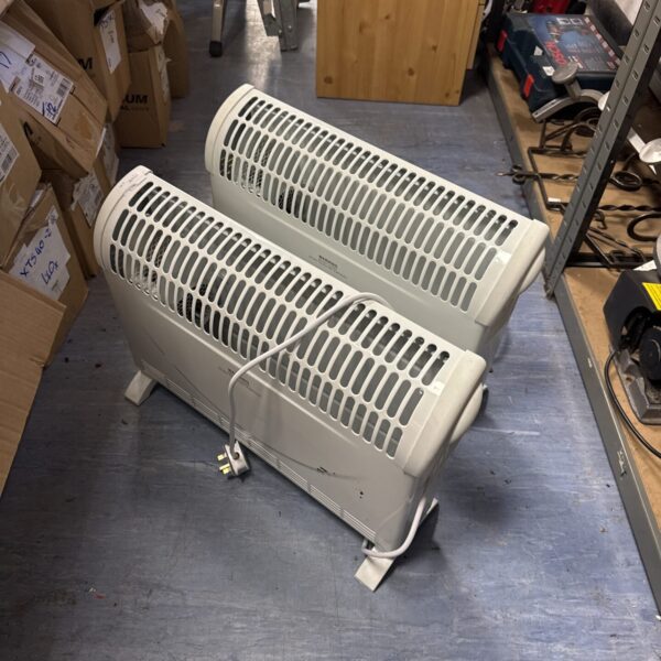 Pair of used portable electric heaters for home heating.
