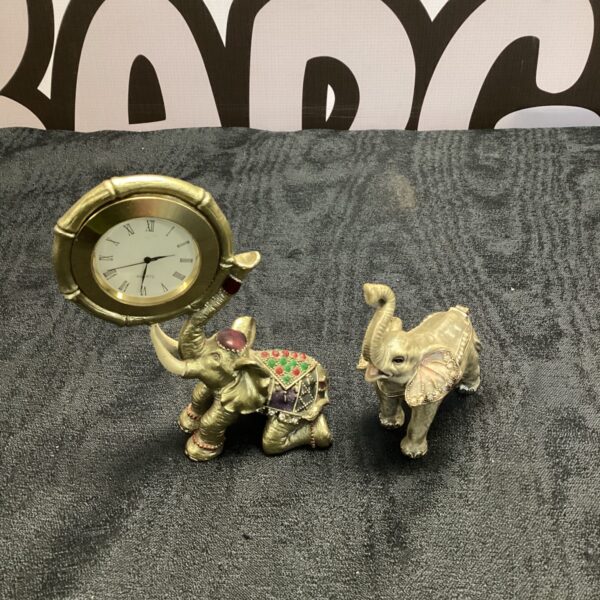 Colourful decorative elephant collection featuring a desk clock and pillbox.