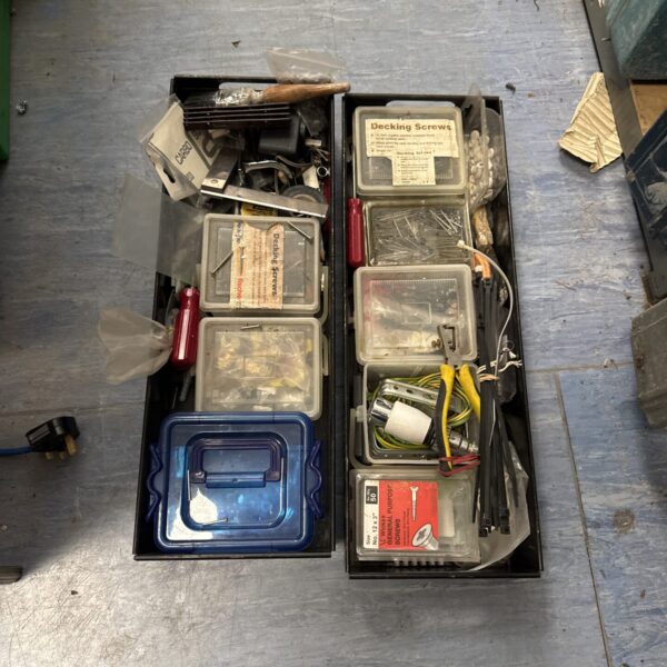 Assorted tools and hardware in two trays, ideal for DIY projects.
